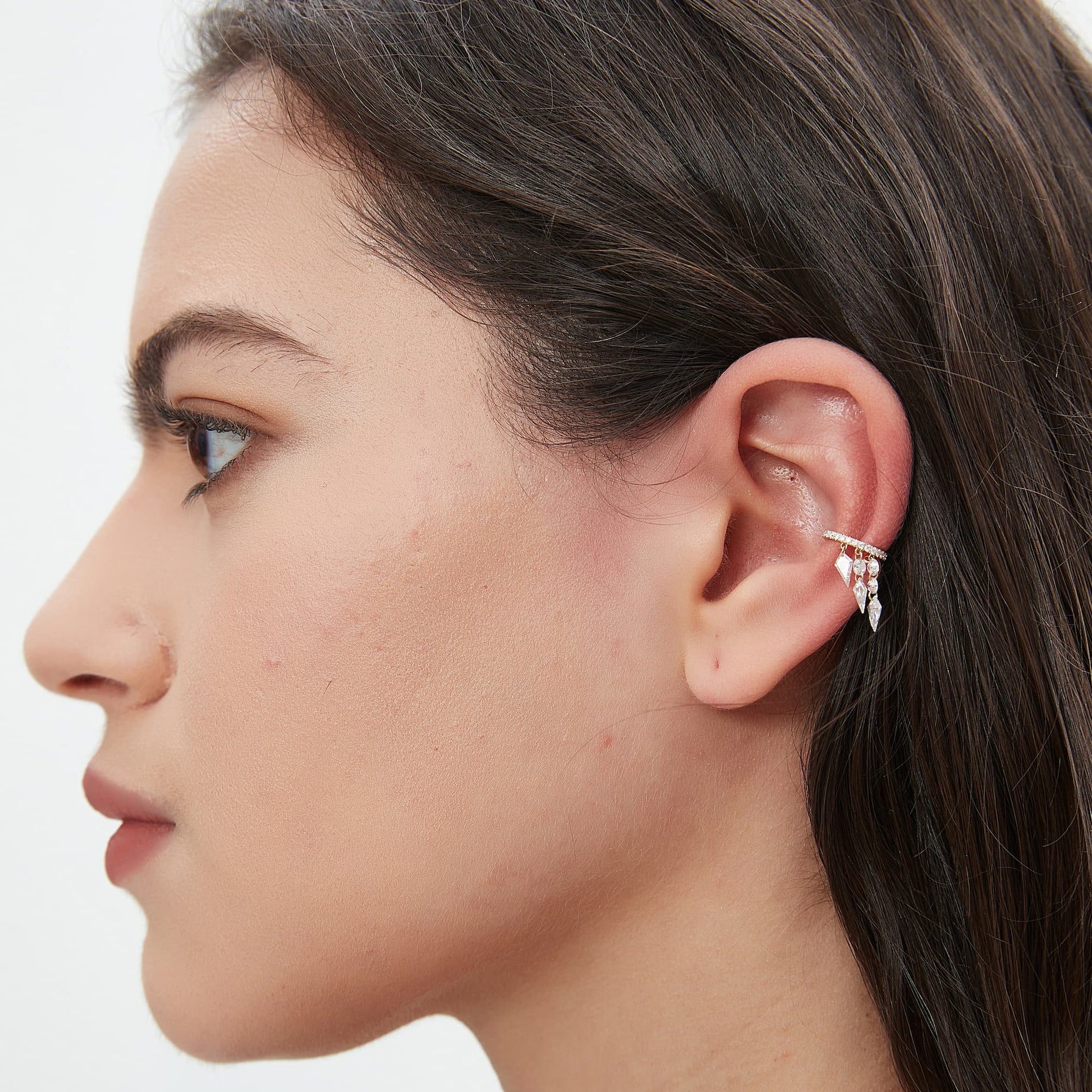 Lifestyle styling of the triple-row kite diamond cuff in an ear stack