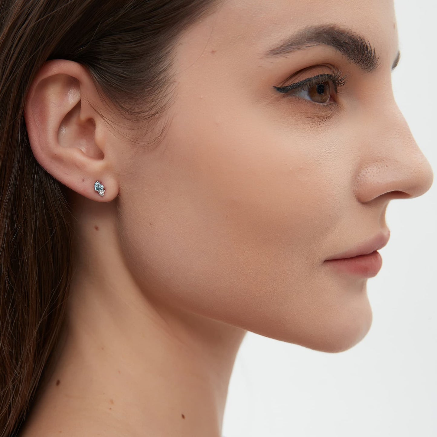 On-ear styling of a romantic ear stack featuring the blue and white heart stud