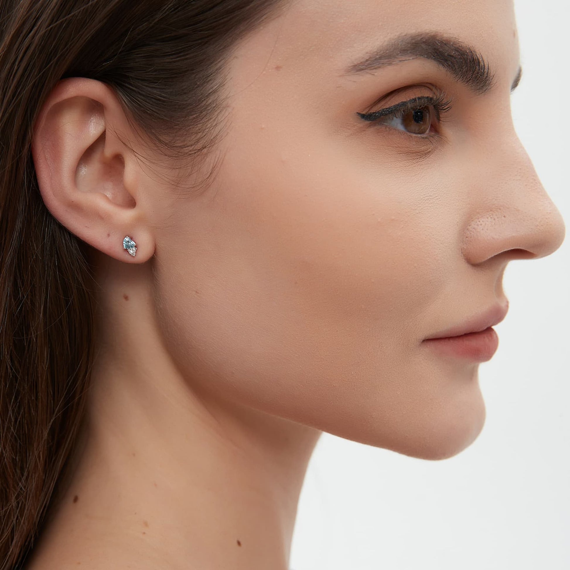 On-ear styling of a romantic ear stack featuring the blue and white heart stud