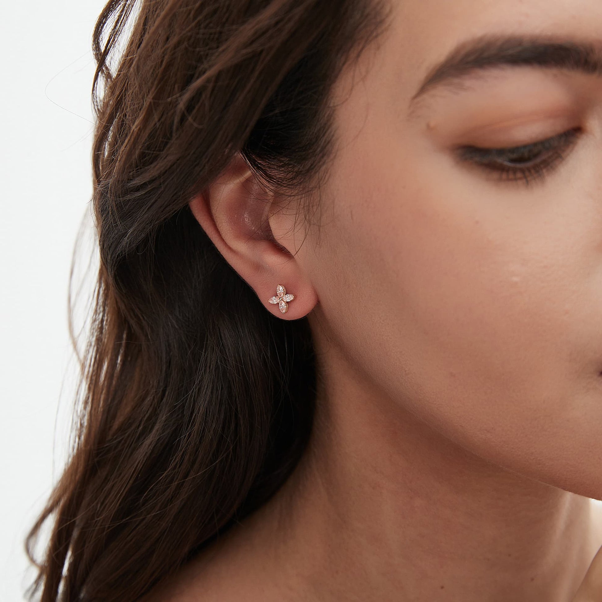 Lifestyle styling of the romantic pink diamond clover stud on a second piercing