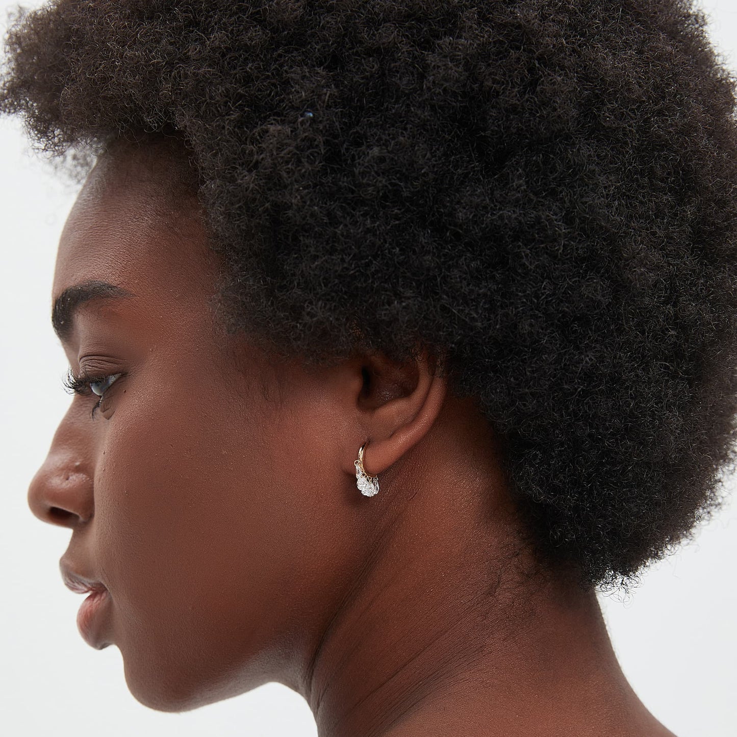 Curated ear stack featuring The Ethereal Dew pear diamond chain dangle hoop