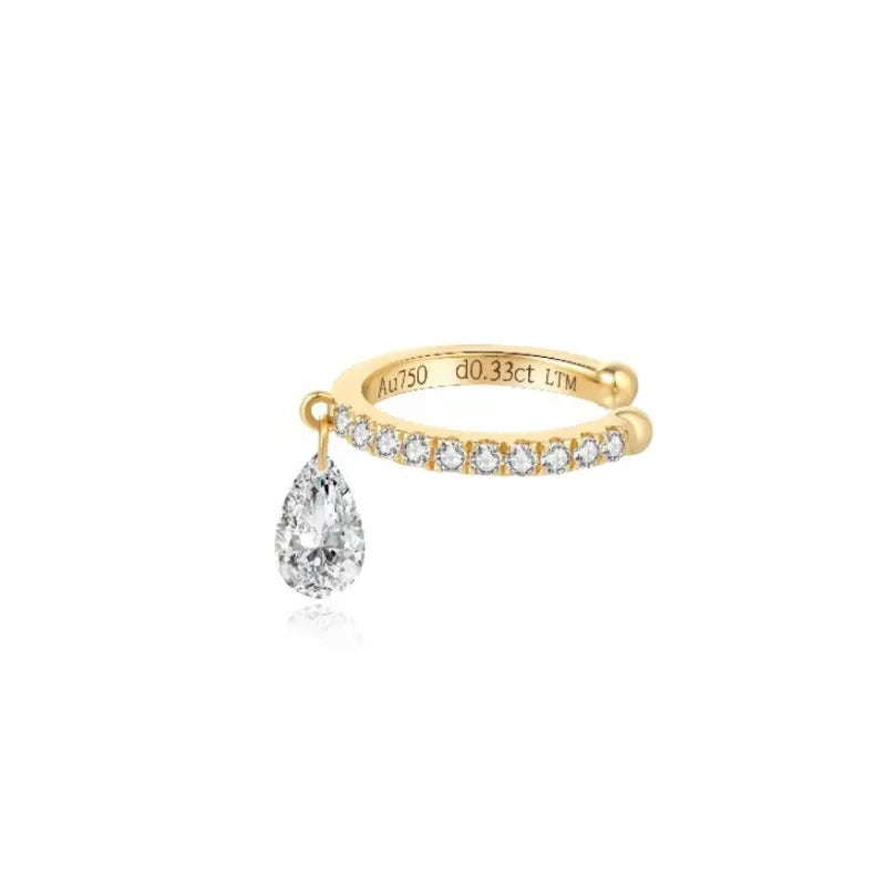 18K solid gold pear diamond ear cuff featuring a suspended floating pear-shaped lab-grown diamond accented by shimmering round diamonds. The sculptural no-piercing cuff creates fluid movement, elongated brilliance, and modern minimalist luxury for elevated curated ear styling.