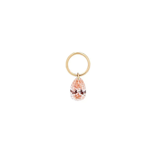A high-resolution studio photograph of the Pear Pink Diamond Earring Charm from the LTM Jewels Blush Symphony collection. Handcrafted in 18K solid gold, the charm features a fancy light pink pear-cut lab-grown diamond in a minimalist laser-drilled setting. The image highlights the high-polish AU750 gold jump ring and the weightless floating effect of the diamond against a clean background, showcasing its status as a romantic cinematic heirloom with VVS-VS clarity.