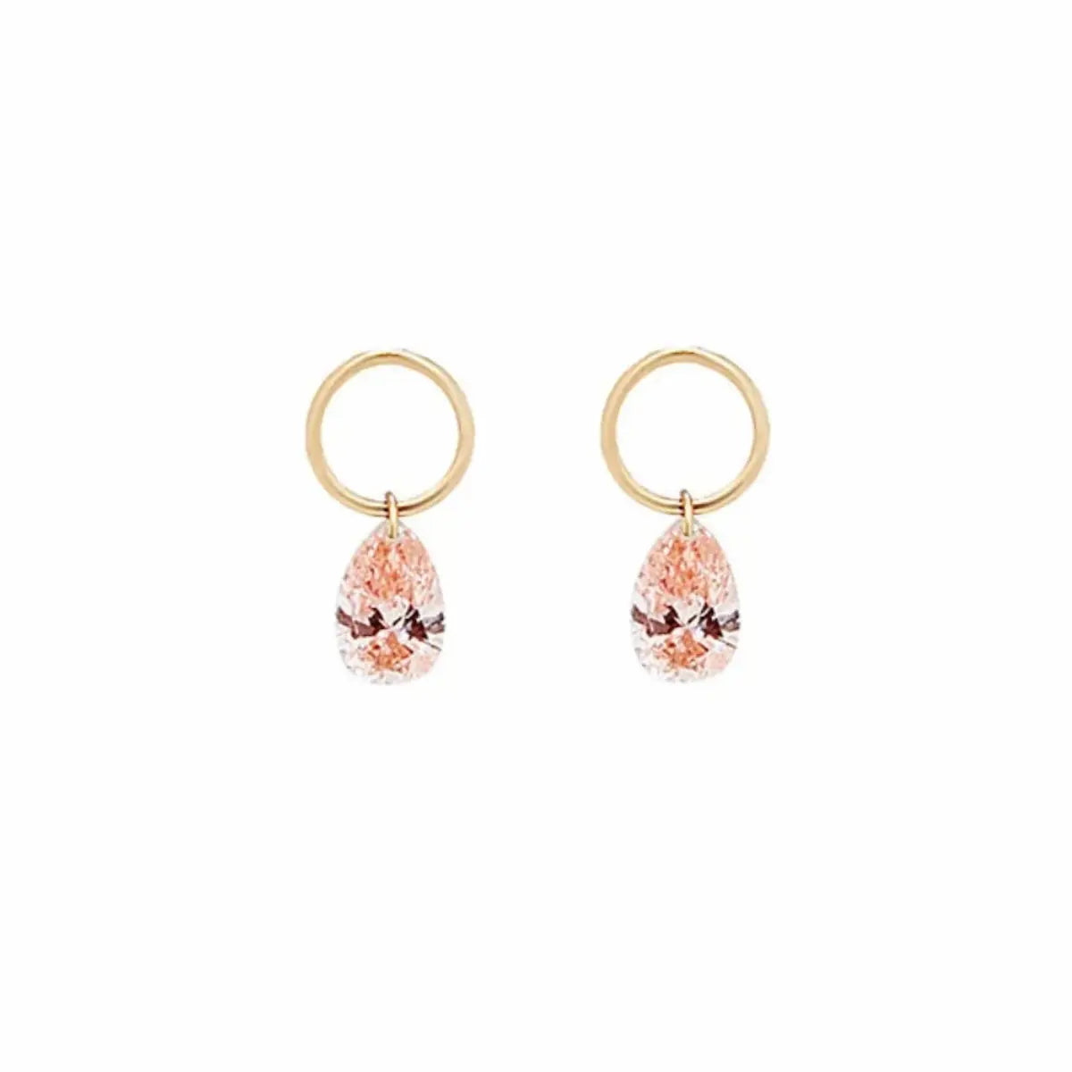 A high-resolution studio photograph of the Pear Pink Diamond Earring Charm from the LTM Jewels Blush Symphony collection. Handcrafted in 18K solid gold, the charm features a fancy light pink pear-cut lab-grown diamond in a minimalist laser-drilled setting. The image highlights the high-polish AU750 gold jump ring and the weightless floating effect of the diamond against a clean background, showcasing its status as a romantic cinematic heirloom with VVS-VS clarity.