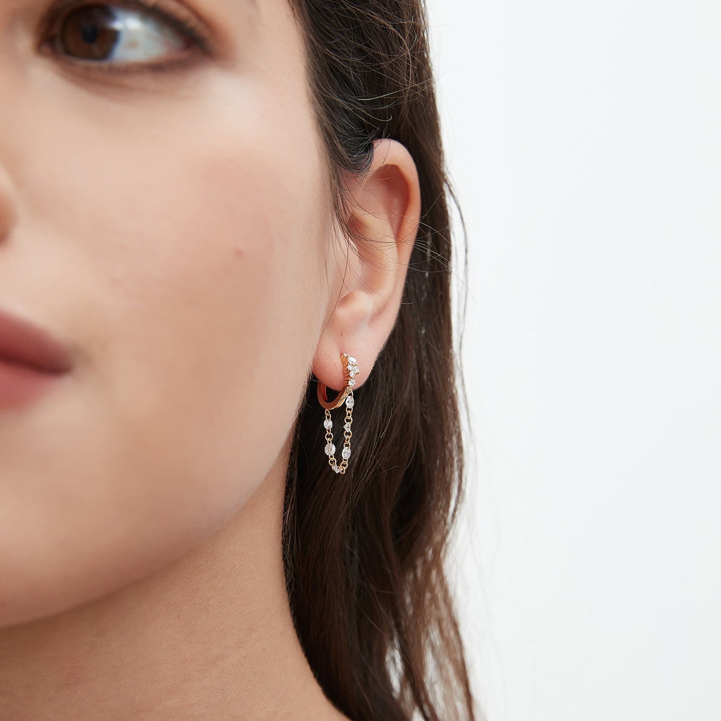 Luxury ear stack featuring the 0.50ctw Radiant Cascade diamond cluster dangle hoop