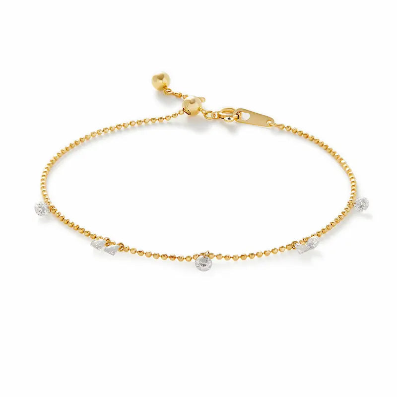 Floating Seven Diamond Bracelet handcrafted in 18K solid gold featuring seven brilliant 0.10ct lab grown round diamonds suspended in LTM Jewels' signature laser-drilled floating setting. Adjustable faceted bead chain bracelet designed for everyday luxury with exceptional sparkle and timeless minimalist elegance.