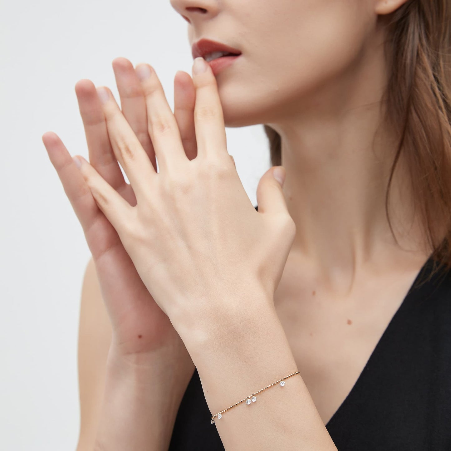 Lifestyle view of the Radiant Drift floating diamond bracelet on a model.