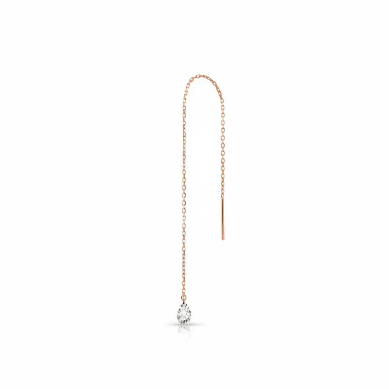 18K solid gold pear-cut diamond threader earring featuring a brilliant lab-grown white diamond suspended from a delicate high-polish gold chain. This minimalist fine jewelry piece by LTM Jewels showcases a sleek, setting-free aesthetic designed for fluid movement and rhythmic sparkle. Available in multiple carat sizes from 0.15ct to 0.5ct, this 18K gold threader is a versatile staple for modern ear stacks and sustainable luxury enthusiasts seeking VVS clarity and D-E color diamonds.