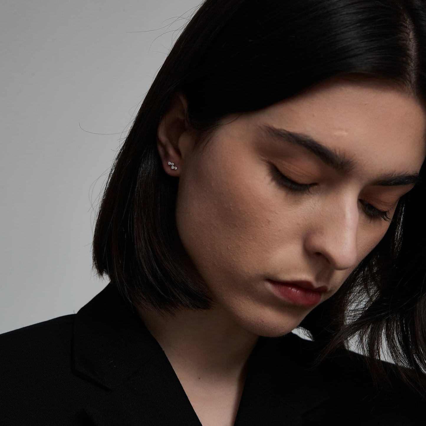 Model wearing The Blush pink diamond threaded stud in a curated ear piercing stack