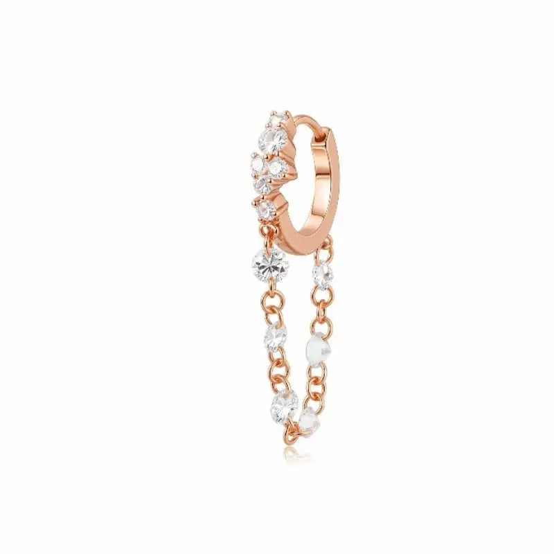 Luxurious 18K solid gold Radiant Cascade diamond dangle hoop earring featuring a brilliant cluster-set huggie paired with a shimmering waterfall chain of six floating lab-grown diamonds. This 0.50ctw fine jewelry piece by LTM Jewels showcases a sophisticated architectural design with VVS-VS clarity and D-E color diamonds. Perfect for modern curated ear stacks, this high-polish 18K gold clicker hoop offers a rhythmic glow and sustainable luxury for discerning jewelry collectors.