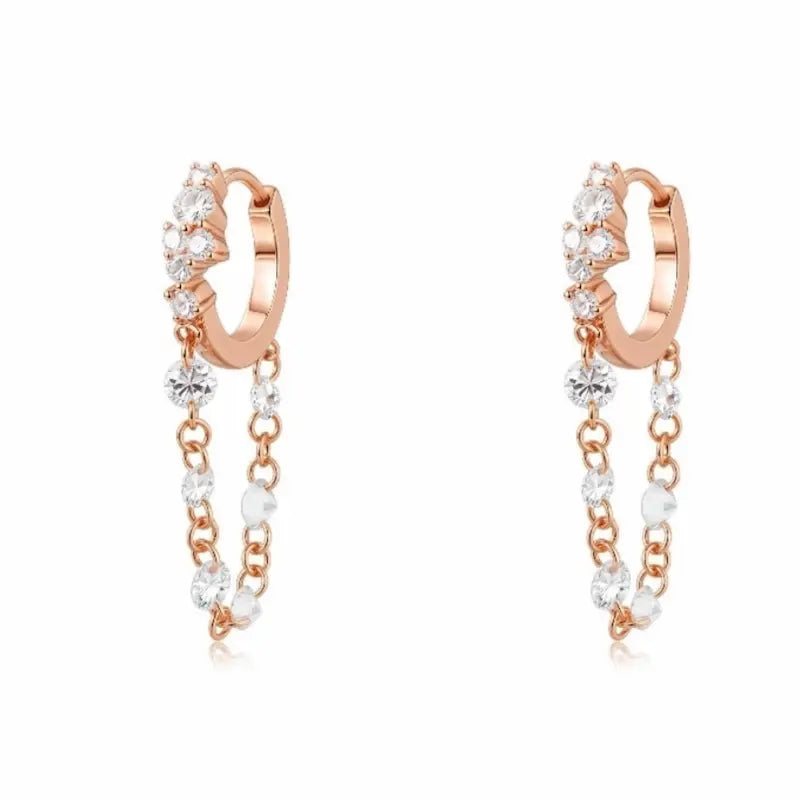 Luxurious 18K solid gold Radiant Cascade diamond dangle hoop earring featuring a brilliant cluster-set huggie paired with a shimmering waterfall chain of six floating lab-grown diamonds. This 0.50ctw fine jewelry piece by LTM Jewels showcases a sophisticated architectural design with VVS-VS clarity and D-E color diamonds. Perfect for modern curated ear stacks, this high-polish 18K gold clicker hoop offers a rhythmic glow and sustainable luxury for discerning jewelry collectors.