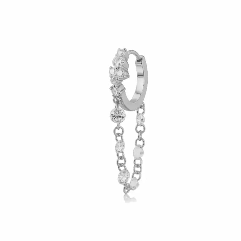 Luxurious 18K solid gold Radiant Cascade diamond dangle hoop earring featuring a brilliant cluster-set huggie paired with a shimmering waterfall chain of six floating lab-grown diamonds. This 0.50ctw fine jewelry piece by LTM Jewels showcases a sophisticated architectural design with VVS-VS clarity and D-E color diamonds. Perfect for modern curated ear stacks, this high-polish 18K gold clicker hoop offers a rhythmic glow and sustainable luxury for discerning jewelry collectors.