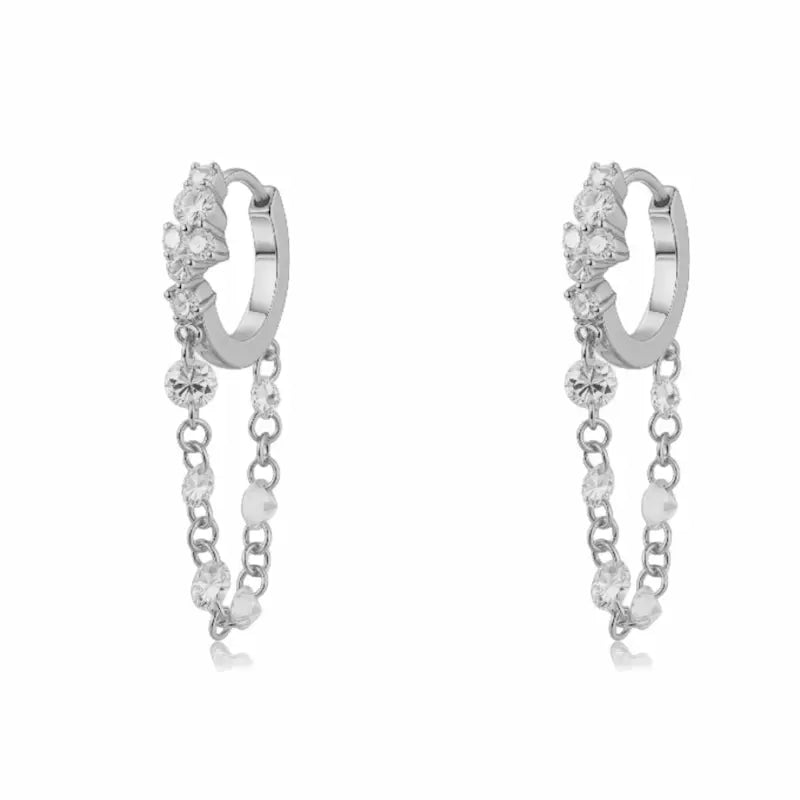 Luxurious 18K solid gold Radiant Cascade diamond dangle hoop earring featuring a brilliant cluster-set huggie paired with a shimmering waterfall chain of six floating lab-grown diamonds. This 0.50ctw fine jewelry piece by LTM Jewels showcases a sophisticated architectural design with VVS-VS clarity and D-E color diamonds. Perfect for modern curated ear stacks, this high-polish 18K gold clicker hoop offers a rhythmic glow and sustainable luxury for discerning jewelry collectors.
