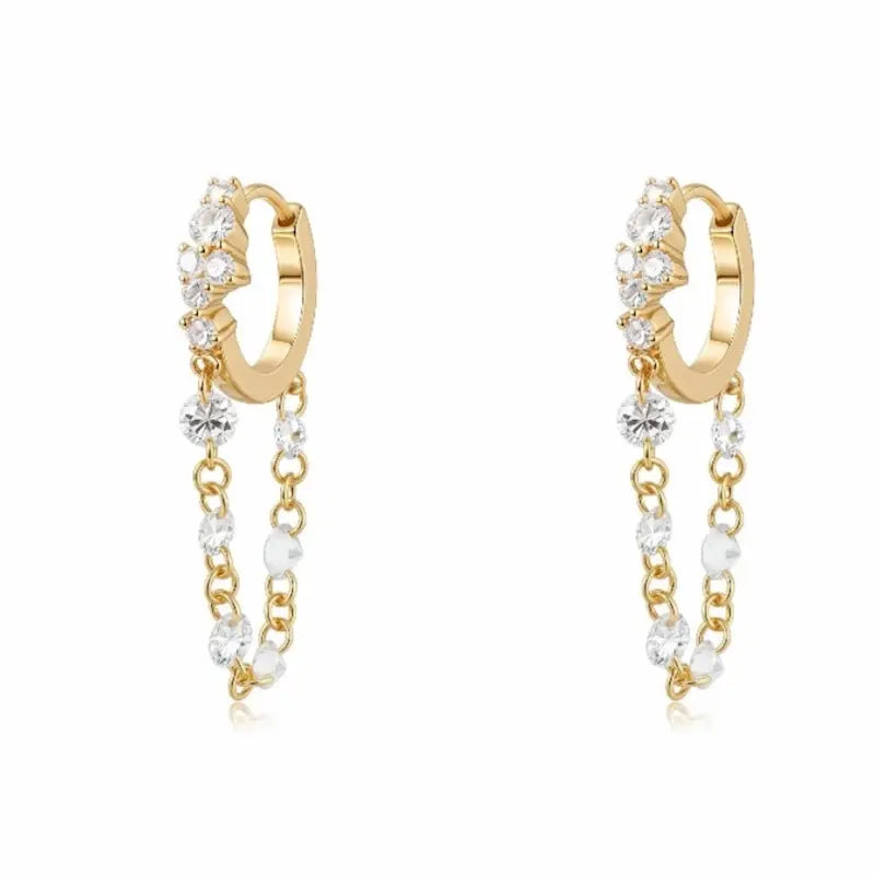 Luxurious 18K solid gold Radiant Cascade diamond dangle hoop earring featuring a brilliant cluster-set huggie paired with a shimmering waterfall chain of six floating lab-grown diamonds. This 0.50ctw fine jewelry piece by LTM Jewels showcases a sophisticated architectural design with VVS-VS clarity and D-E color diamonds. Perfect for modern curated ear stacks, this high-polish 18K gold clicker hoop offers a rhythmic glow and sustainable luxury for discerning jewelry collectors.