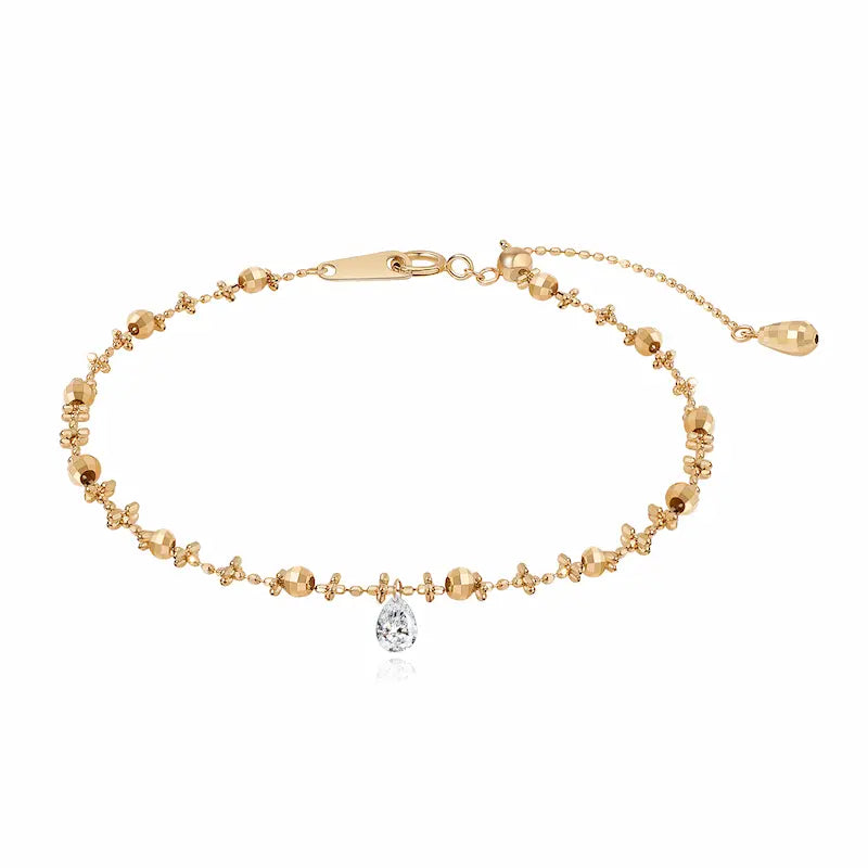 Floating Pear Diamond Bracelet handcrafted in 18K solid gold featuring a 0.15ct lab grown pear-cut diamond in a signature laser-drilled floating setting. Adjustable bead chain bracelet with a minimalist, elegant silhouette designed for everyday luxury, stacking, and timeless fine jewelry styling.