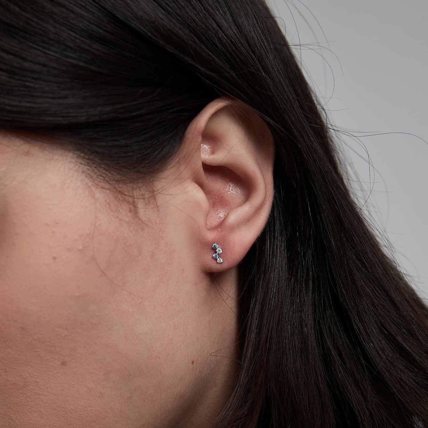 Detail view of 18K gold internally threaded flat back post for comfort