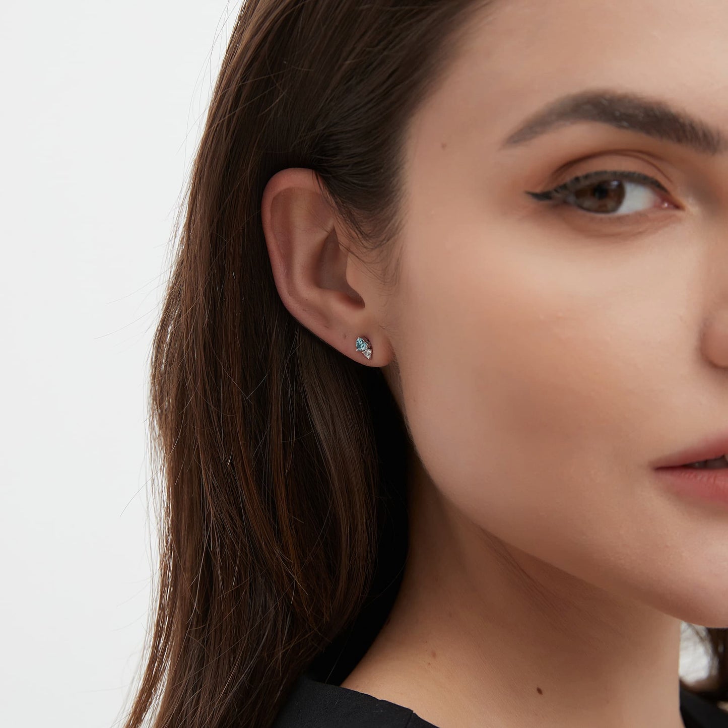 Side view of the double heart diamond stud showing the secure 18K gold threaded post