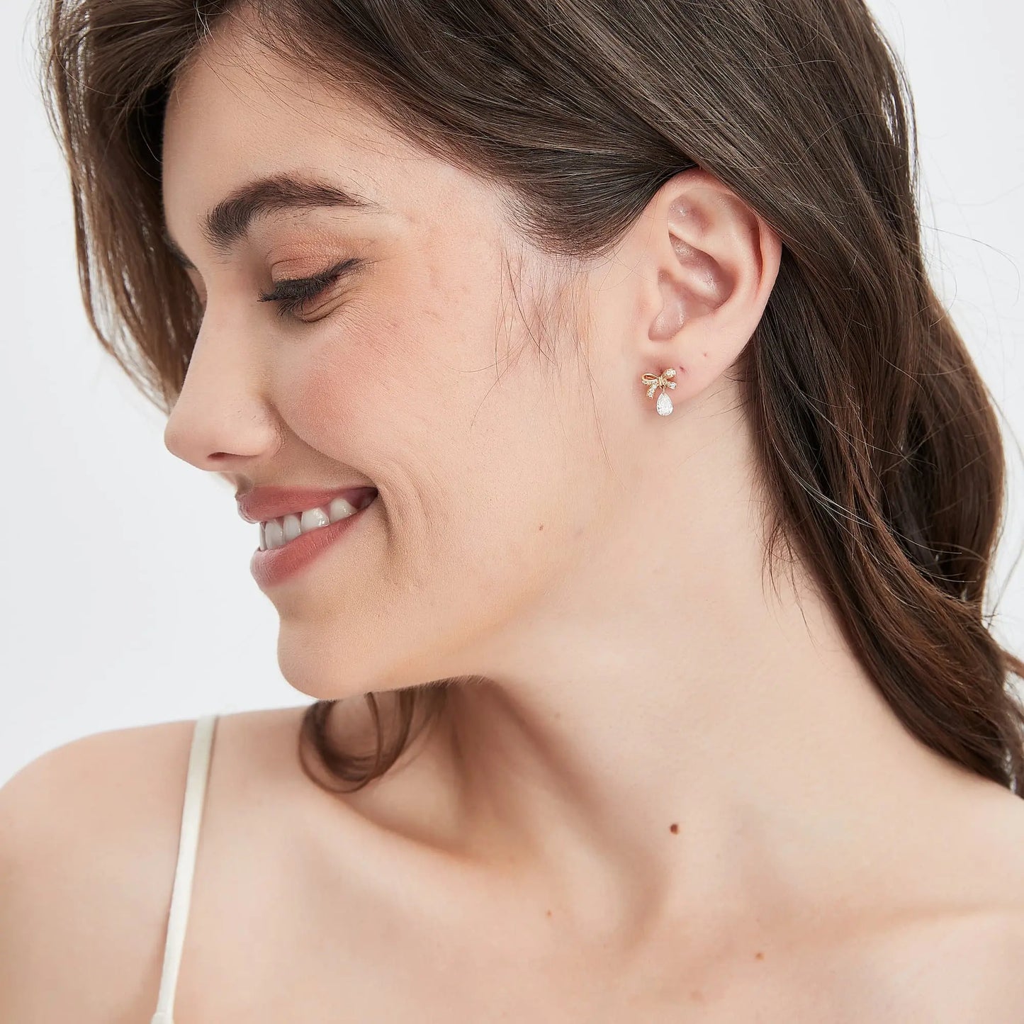 Side profile showing the secure threaded screw back and dangling structure.