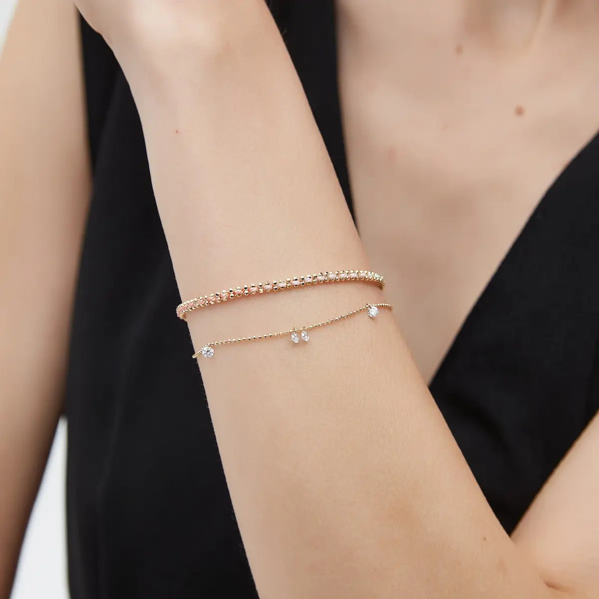 Macro close-up of the Floating Diamond Rope Bracelet handcrafted in solid 18K gold. The precision-drilled floating round diamonds and textured woven rope chain create uninterrupted brilliance, fluid movement, and refined architectural craftsmanship inspired by modern luxury jewelry design.
